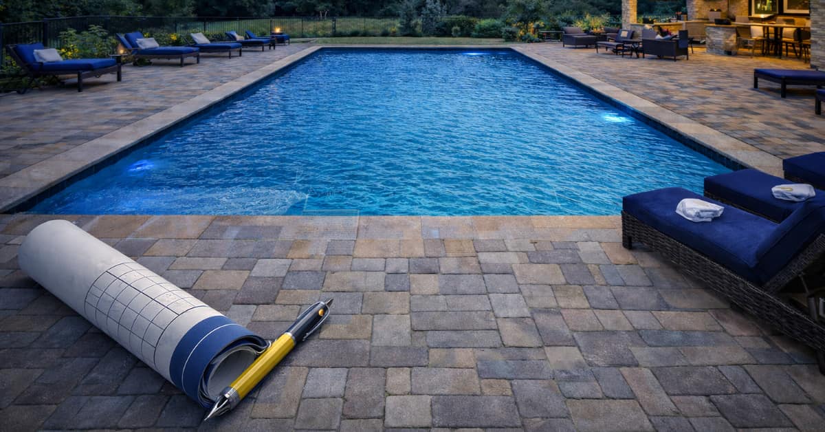Building Pool Deck Plans on pavers with pool in background